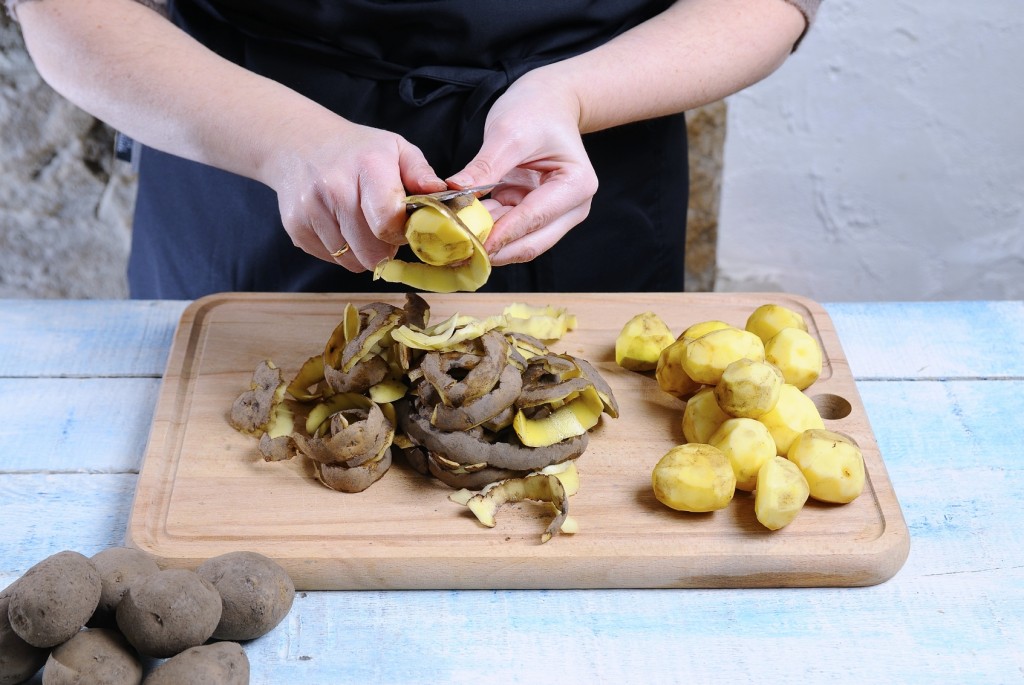 Peeling potatoes.