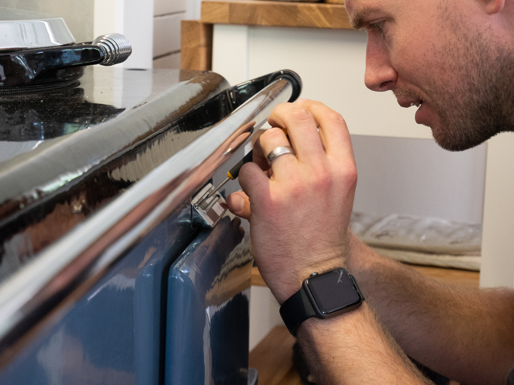 Carl servicing an Aga with meticulous care and attention.